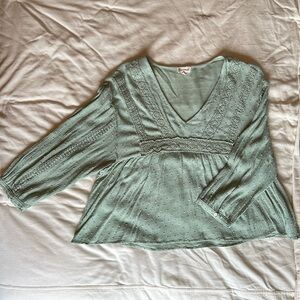 Large, mint green Hem and Thread top